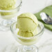 A close-up of a scoop of Acai Roots Matcha Cream Sorbet in a glass bowl.