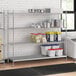 A stainless steel wire shelf unit with solid stainless steel shelves.