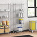 Regency chrome wire shelving with solid galvanized steel bottom shelf in a kitchen.