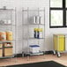 Regency chrome wire shelving unit in a professional kitchen with containers on shelves.