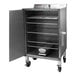 A stainless steel SmokinTex 1460 Pro Series electric smoker with racks of food.