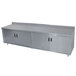 a stainless steel counter with sliding doors