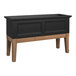 A black rectangular elevated garden bed with wooden legs.