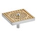 A gold metal square surface mount with holes.