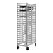 A New Age aluminum pizza pan rack with wheels.