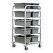 A metal rack with grey bins on it.