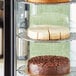 A display case with three Sirabella's pre-cut vegan cheesecakes.