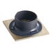 A black plastic pipe with a metal ring and a square black plastic object with a metal ring inside.