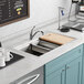 An American Standard Chive workstation sink installed in a kitchen counter.