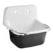 An American Standard white cast iron wall-mount service sink with a silver rim.