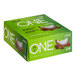 A green ONE Chocolate Almond Bliss Protein Bar box with white and green text. The box shows almonds and coconut.