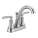 A close-up of a silver Delta deck-mount faucet with two lever handles.