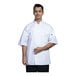 A man wearing a white Uncommon Chef short sleeve chef coat with white mesh.