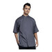 A man wearing a Uncommon Chef short sleeve chef coat with slate accents.
