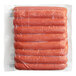 A package of Sabrett skinless spicy beef hot dogs in plastic wrap.