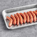 A tray of Sabrett Mini Beef Franks on a white surface.