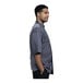 A man wearing a Uncommon Chef Florence short sleeve chef coat with a grey mesh back.
