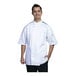 A man wearing a white Uncommon Chef Brac chef coat with black mesh.