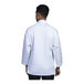 A man wearing a white Uncommon Chef Treviso 3/4 sleeve chef coat.