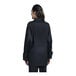 The back view of a woman wearing a black Uncommon Chef Pescara chef coat with a black half mesh back.