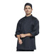 A man wearing a Uncommon Chef black long sleeve chef coat with silver mesh back.