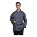 A man wearing an Uncommon Chef Slate 3/4 Sleeve Chef Coat with Slate Mesh Back.