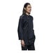 A woman wearing a black Uncommon Chef Solta long sleeve chef coat with a silver mesh back.