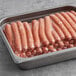 A tray of Vienna Beef skinless beef franks in plastic packaging.