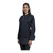 A woman wearing a black Uncommon Chef long sleeve chef coat with a black mesh back.