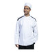 A man wearing a white Uncommon Chef Capri chef coat with black mesh details.