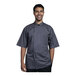 A man wearing a Uncommon Chef Venice short sleeve chef coat with a slate mesh back.