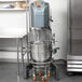 An Avantco 60 quart floor mixer in a kitchen.