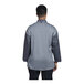 The back of a Uncommon Chef slate and black chef coat with a grey mesh back.