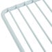 A close-up of an Avantco metal wire shelf for back bar refrigerators.