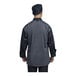 The back of a black Uncommon Chef Capri long sleeve chef coat with silver heather mesh.