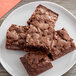 A close-up of a brownie with Kraft Caramel Bits on top.