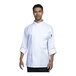 A man wearing a Uncommon Chef white long sleeve chef coat.