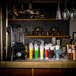 A Flavour Blaster JetChill cocktail machine on a counter with drinks.