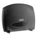 A black Kimberly-Clark Professional jumbo roll toilet paper dispenser.