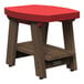 A red rectangular side table with a wooden base.