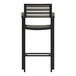 A gray stackable outdoor bar stool with arms and a backrest.