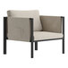 A Flash Furniture black steel armchair with beige cushions and storage pockets.