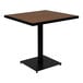 A square brown faux teak table with black trim.