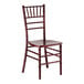 A mahogany wood Chiavari chair with a slatted back and decorative spindle detailing.