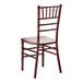 A mahogany wood Chiavari chair with a decorative spindle back and square seat.