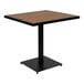 A Flash Furniture square table with a natural faux teak wood slat top and black base.