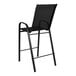 A Flash Furniture black outdoor barstool with a black mesh seat.