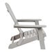 A close up of a gray Flash Furniture faux wood Adirondack chair with armrests.