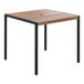 A Flash Furniture square table with a natural faux teak wood top and black legs.