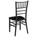 A Lancaster Table & Seating black wood chiavari chair with a black seat.